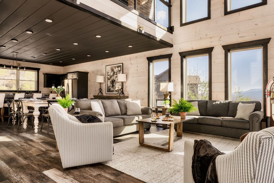 Spacious Gathering Area – The open living room offers plush seating and a welcoming atmosphere for conversation, movie nights, or morning coffee.