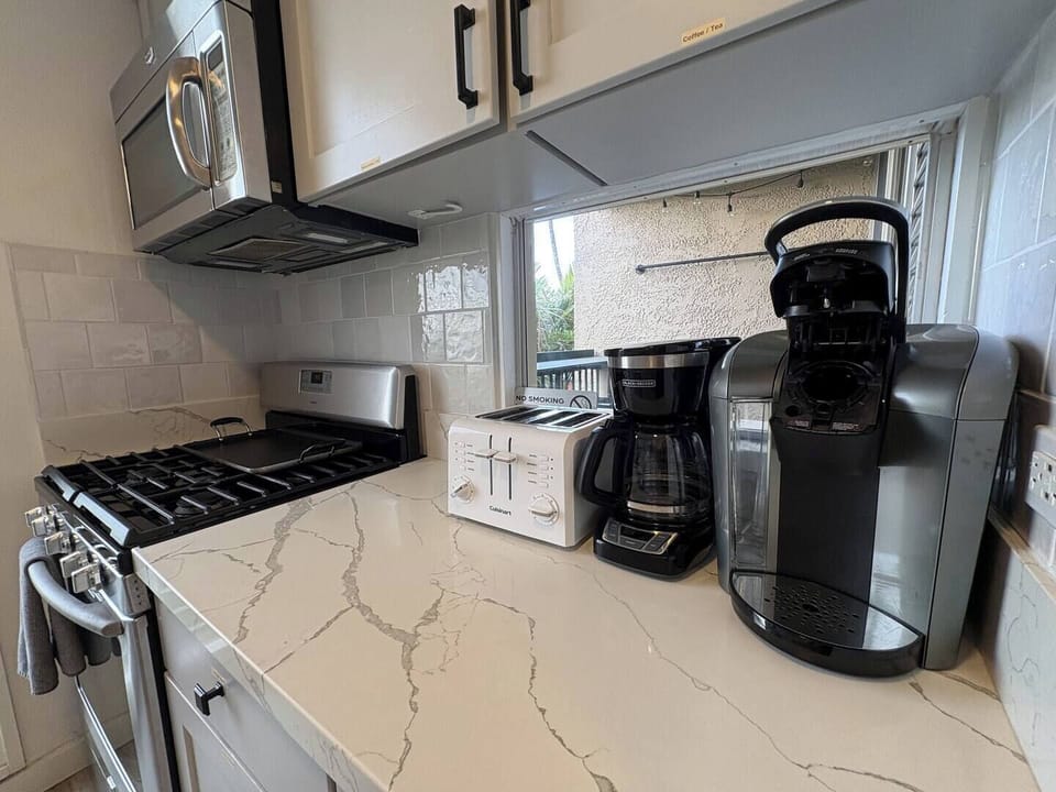Keurig, coffee maker, toaster, griddle, Instant Pot, and all the pots, pans, utensils, and spices you need to dine in no time.