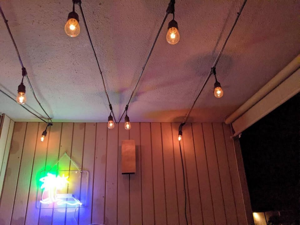 String-light vibes for an evening at the balcony bar. 