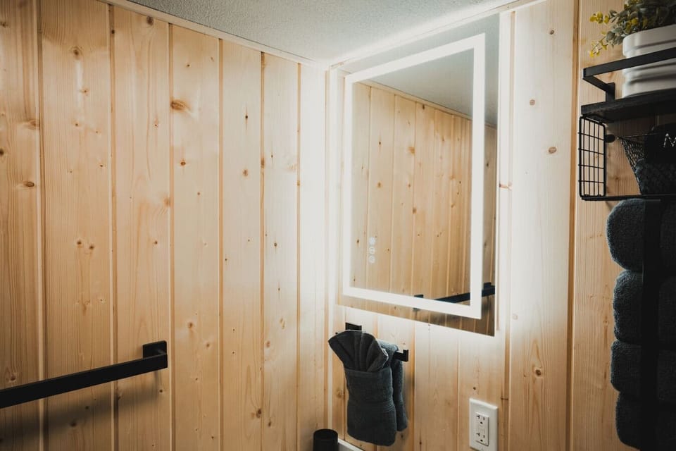 Sleek LED Light-Up Bathroom Mirror- Adds a touch of elegance & functionality. Perfect for grooming or getting ready.  Soft, even lighting enhances the space & offers a bright, clear reflection.