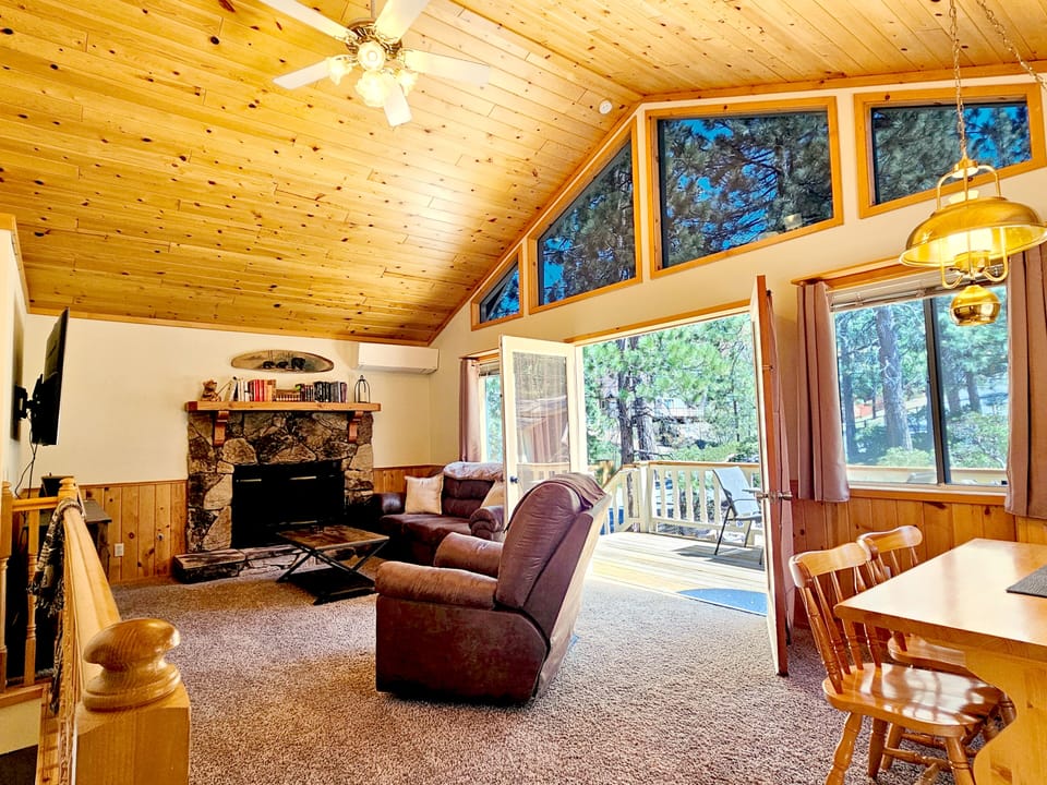 Bright, open living space with cozy fireplace.