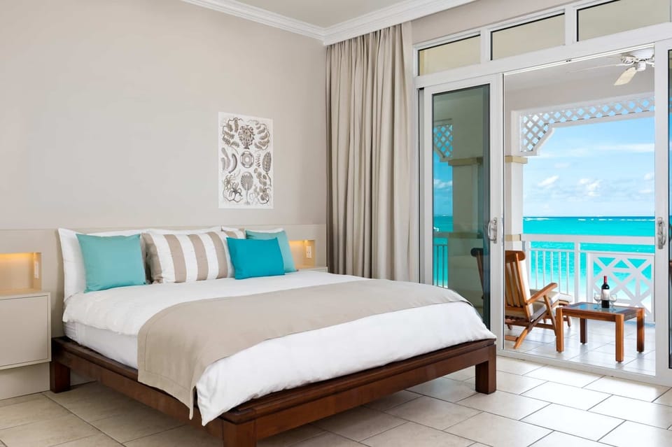 Wake up to ocean panoramas from your serene bedroom retreat.