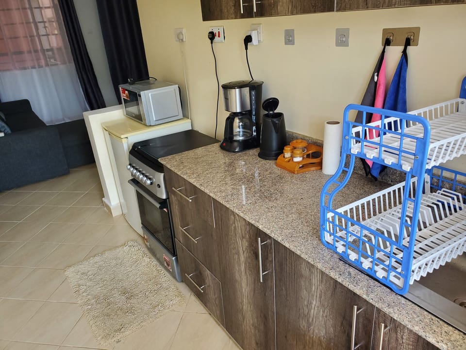 Kitchen- refrigerator, microwave, coffee maker, water heater