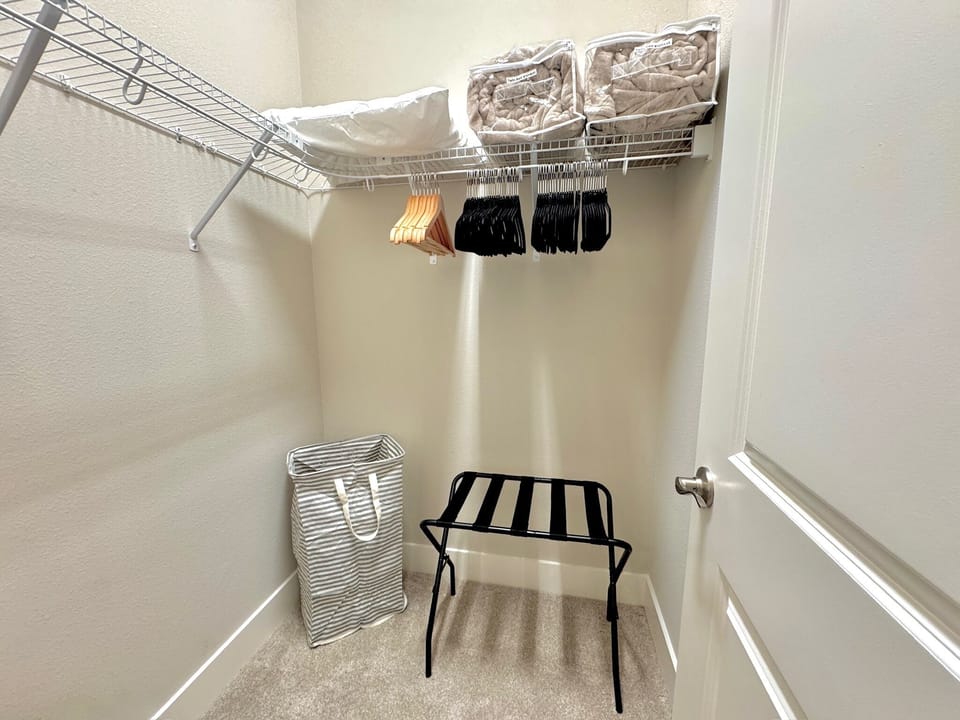 The walk-in closet is a useful addition to the twin beds room, and you’ll also find a basket filled with kid’s toys.