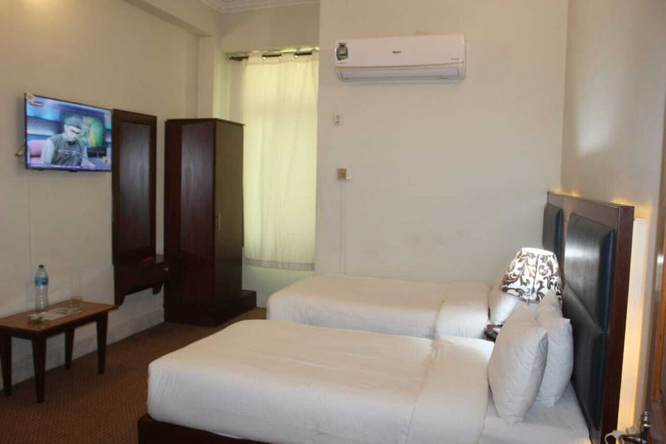 Deluxe Double or Twin Room, Patio | Bathroom | Shower, slippers, towels, soap