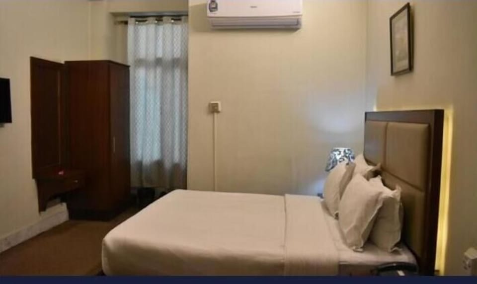 Deluxe Single Room, Patio, City View | Bathroom | Shower, slippers, towels, soap