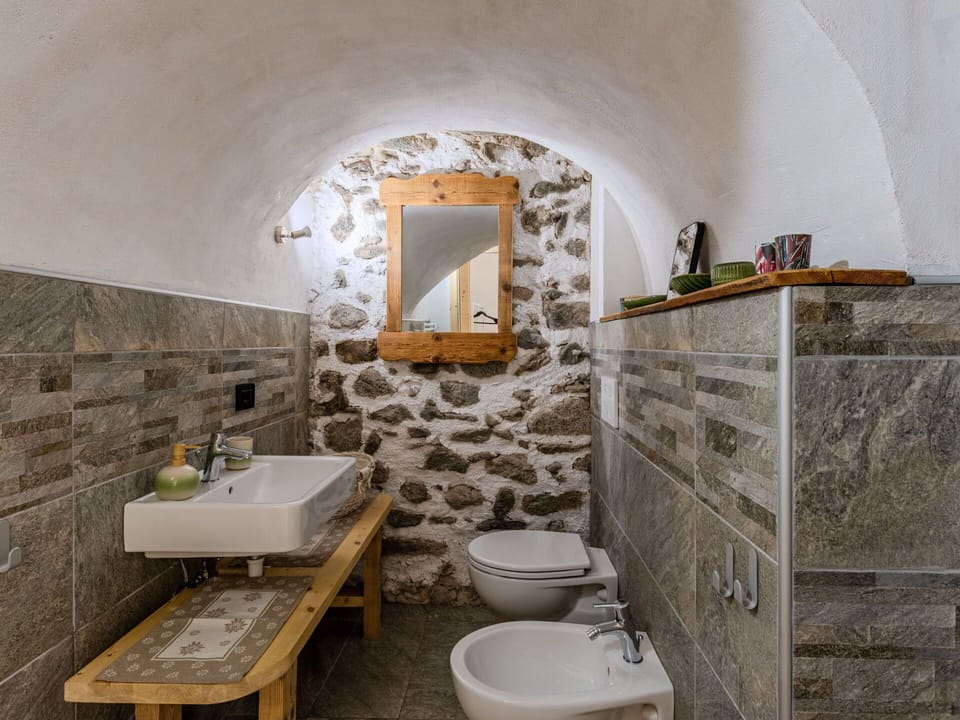 Wall, Flooring, Plumbing Fixture, Floor, Stone Wall, Ceiling, Interior Design, Tile, Tap, Sink