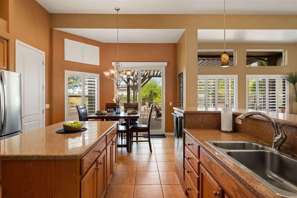 View of breakfast nook area that looks into the back yard