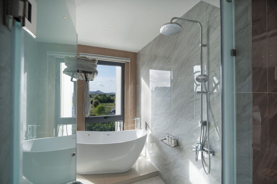 Executive Double Room, Beach View | Bathroom | Hair dryer, slippers, towels, soap