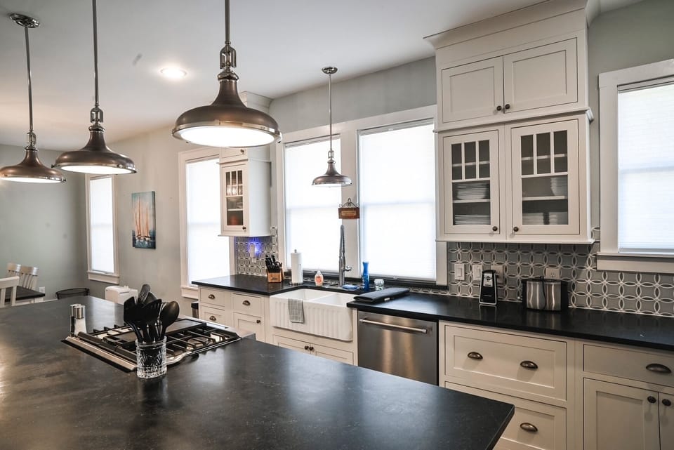 Kitchen with gas range, dishwasher, fridge with ice in door