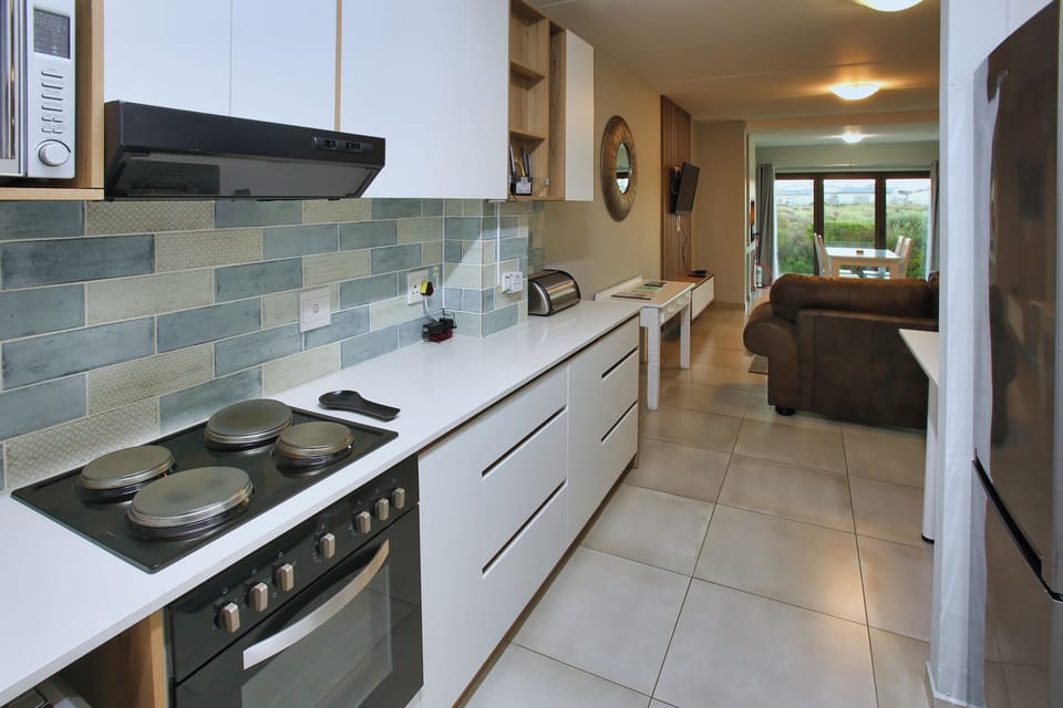 Family Apartment, Balcony, Garden View | Private kitchen | Full-size fridge, microwave, oven, stovetop
