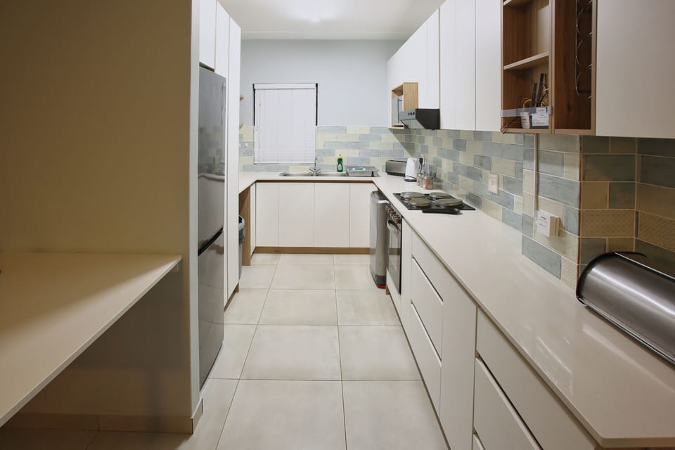 Family Apartment, Balcony, Garden View | Private kitchen | Full-size fridge, microwave, oven, stovetop
