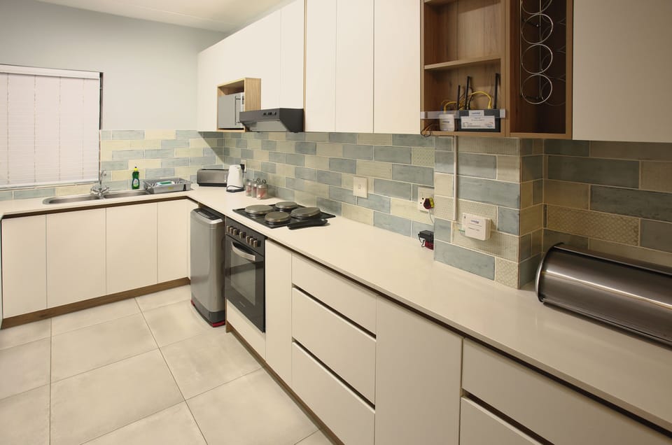 Family Apartment, Balcony, Garden View | Private kitchen | Full-size fridge, microwave, oven, stovetop