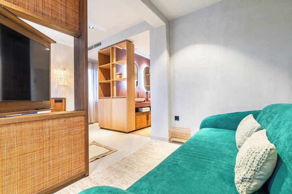Deluxe Suite, Sea View | Free minibar items, in-room safe, iron/ironing board, free WiFi