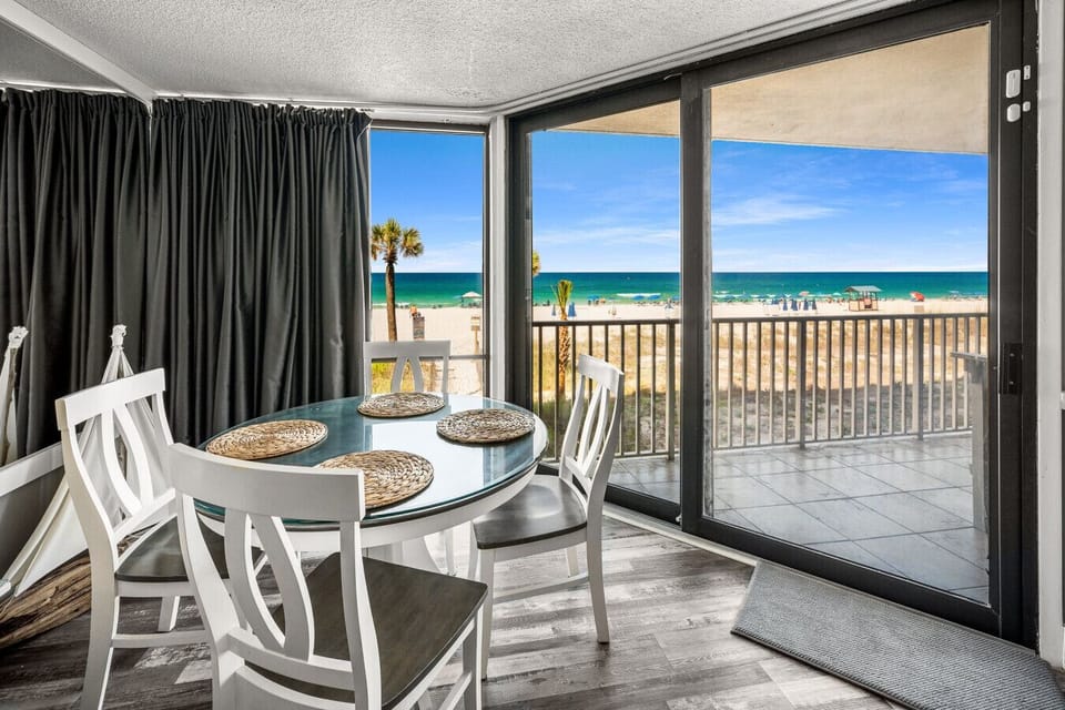 The perfect spot for dinners in, game night, or a remote workstation with front-row views of the beach and ocean through expansive corner windows.