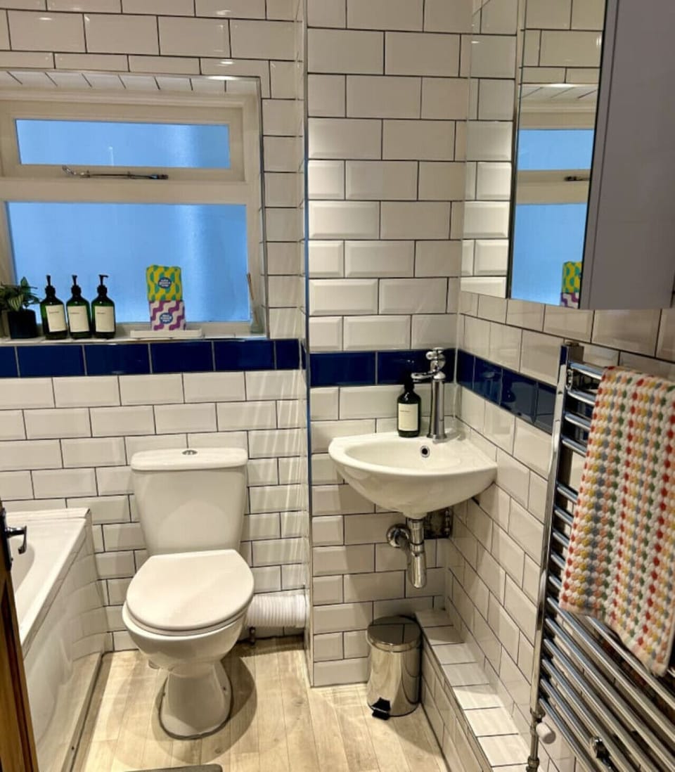 Bathroom with over bath shower
