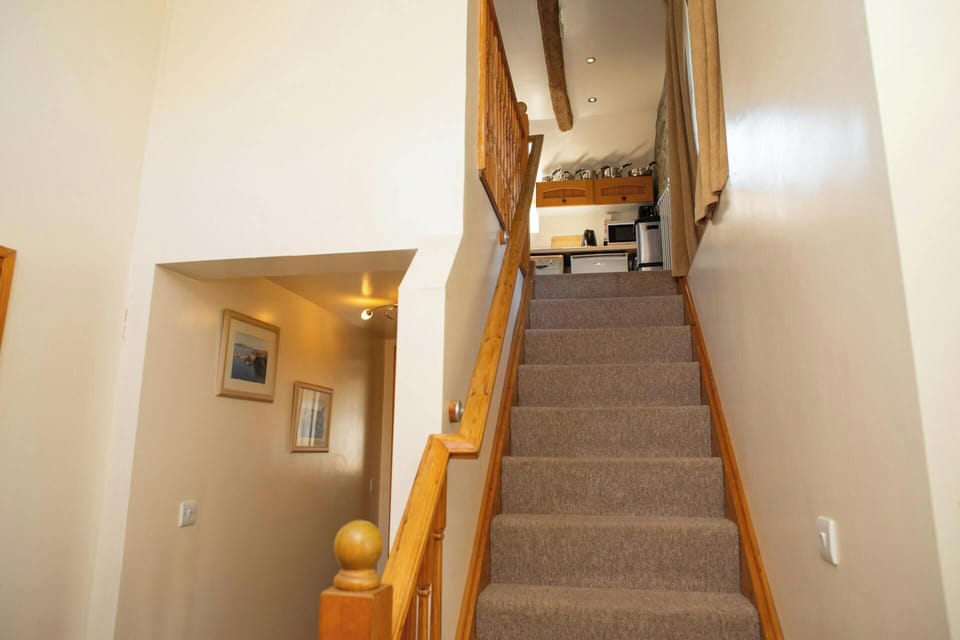 Stairs leading to first floor living accommodation