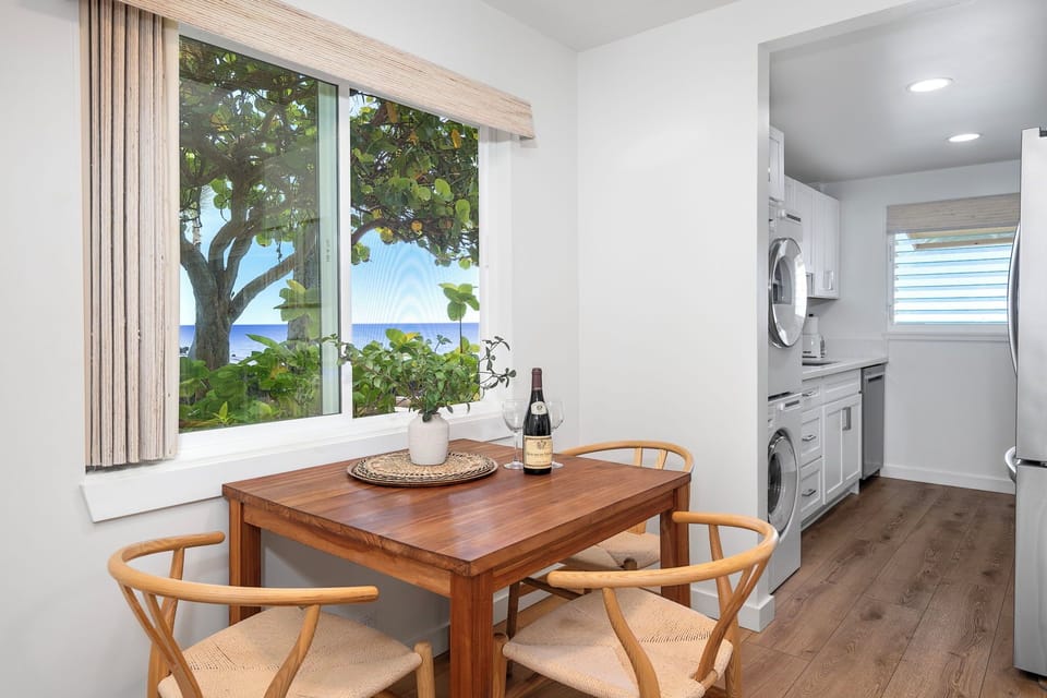 Cozy corner dining nook with ocean views—perfect for morning coffee or a sunset dinner.