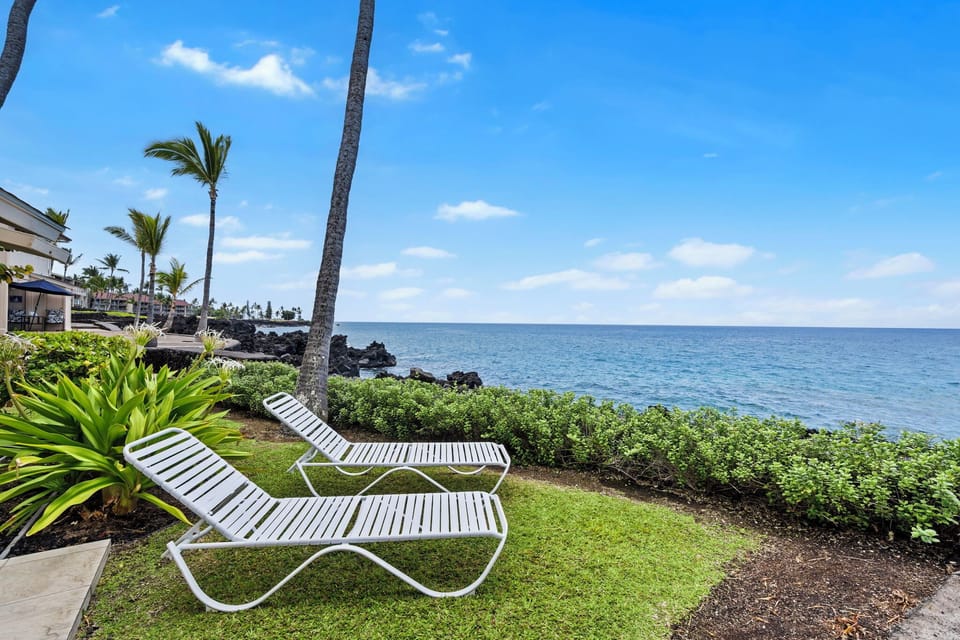 Lounge by the shoreline just steps from your lanai for ultimate oceanfront relaxation.
