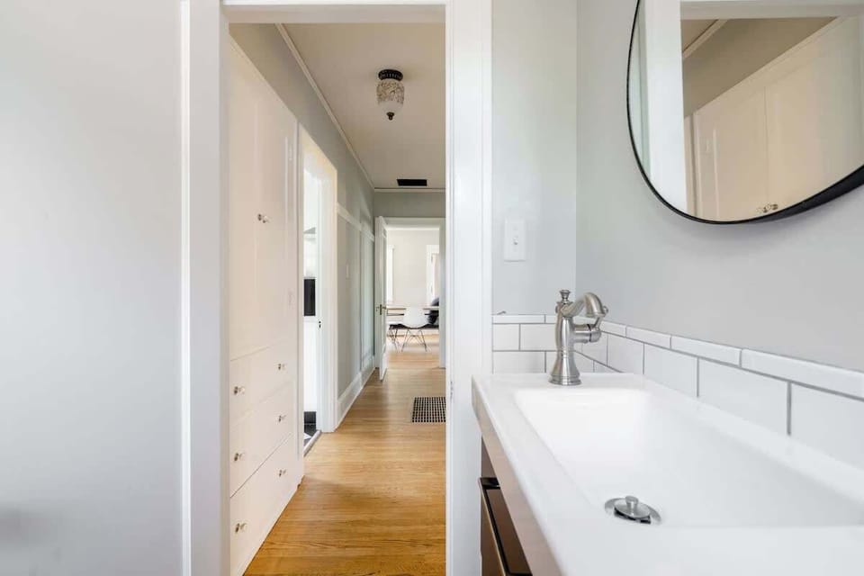 Full bathroom 1 vanity along the hallway.