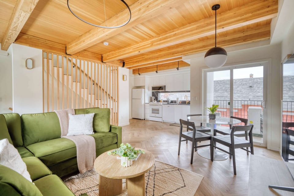 Living room open to dining and kitchen.