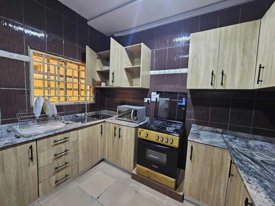 Family Apartment, Balcony, City View | Private kitchen | Fridge, microwave, oven, stovetop
