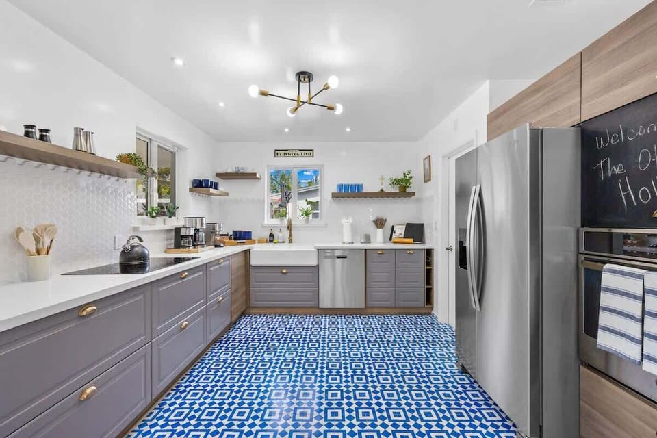 Kitchen: Bright and airy space with stylish tile, modern amenities, and a touch of tropical flair!