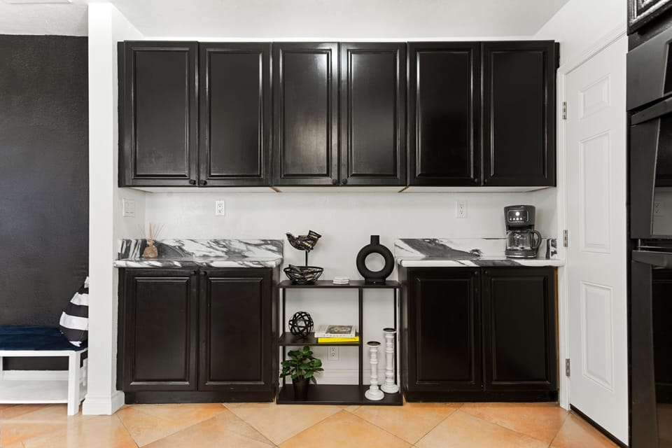 Fully Equipped Kitchen with silverware and dinnerware wine glasses.