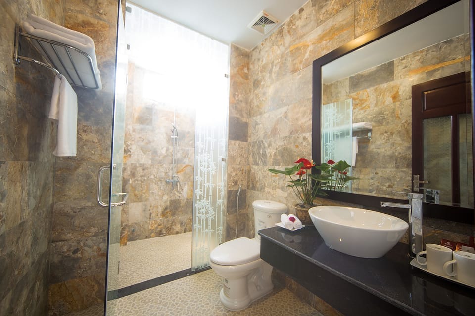 Shower, free toiletries, slippers, towels