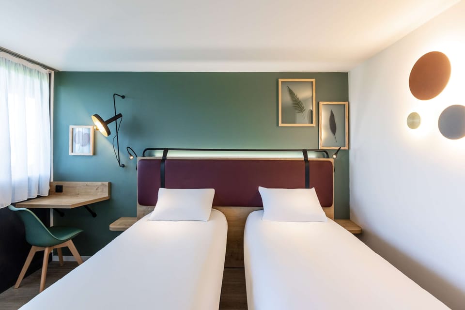 Premium bedding, desk, laptop workspace, blackout drapes