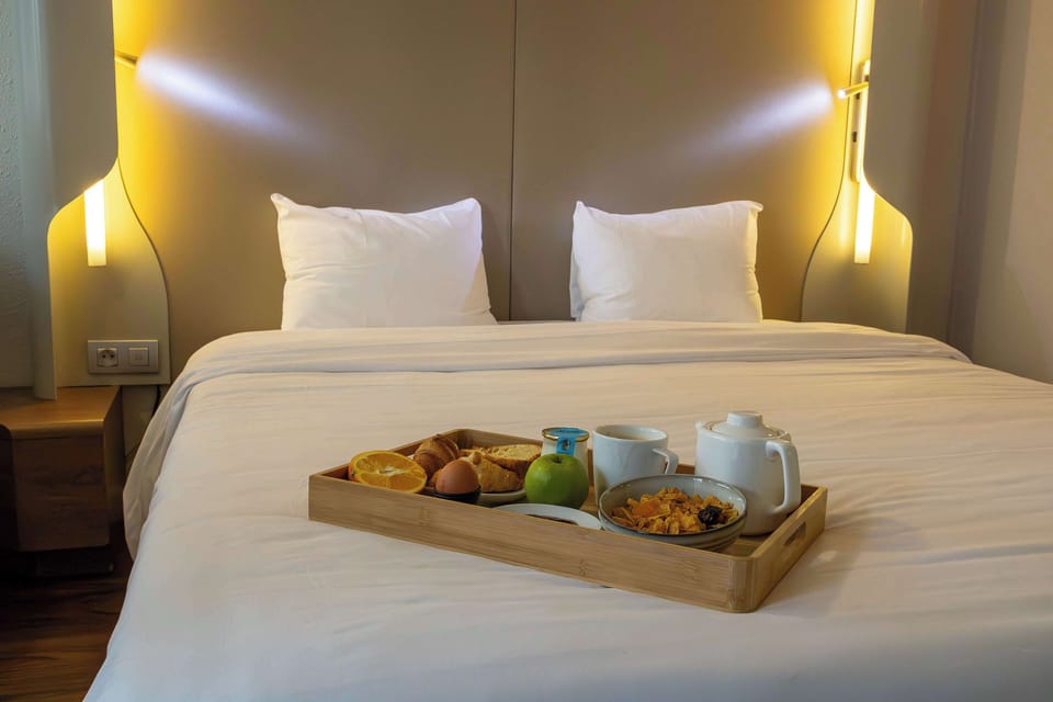 Premium bedding, desk, laptop workspace, soundproofing