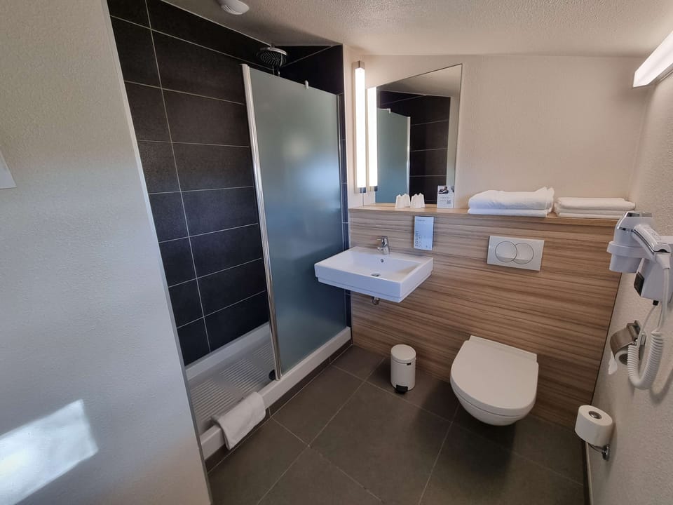 Family Room, 2 Double Beds | Bathroom | Eco-friendly toiletries, hair dryer, towels