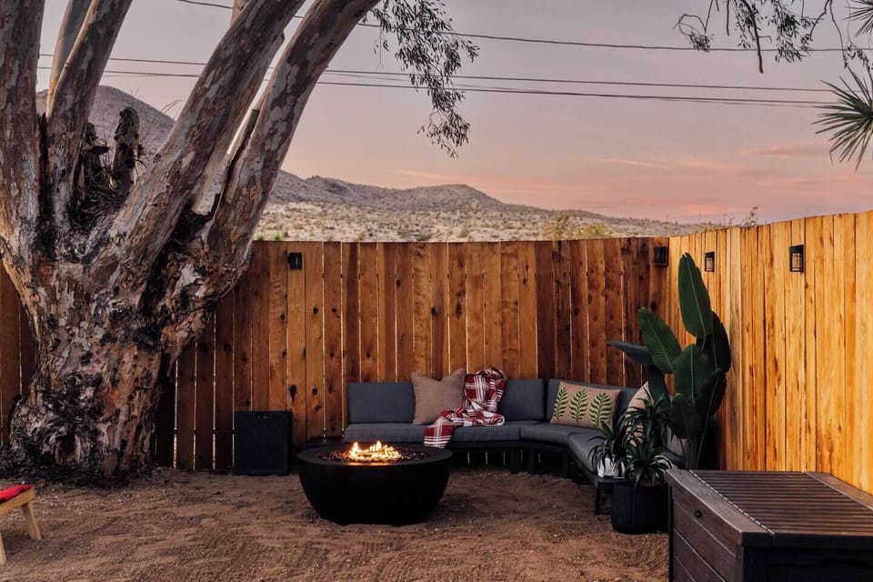 Enjoy our relaxing private backyard featuring a jacuzzi, fire pit, lounge area, and picnic table framed by mountain views. Start your day with stunning sunrises, unwind with colorful sunsets, and end the night soaking under a star-filled sky. 