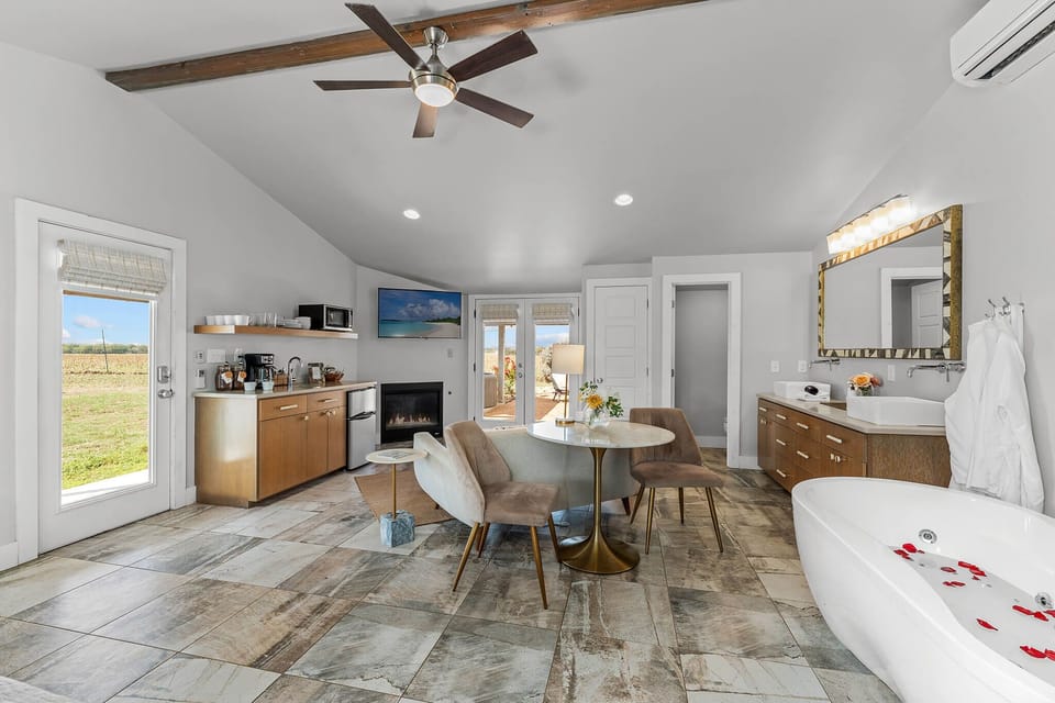 From the inviting sofa to the perfectly placed café table, this living area is your personal sanctuary. Kick back with a drink, catch a favorite movie, or enjoy breakfast with a view—it’s all right here, effortlessly within reach.