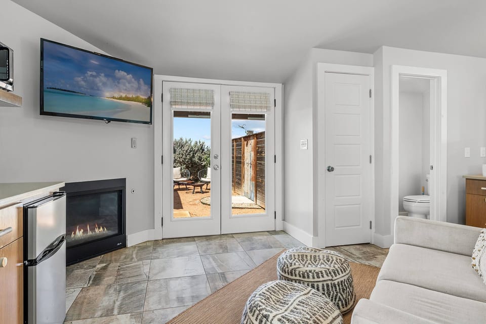 The indoor gas fireplace brings instant comfort and charm to the studio—perfect for curling up with a blanket, a good book, or your favorite show after a day exploring wine country.