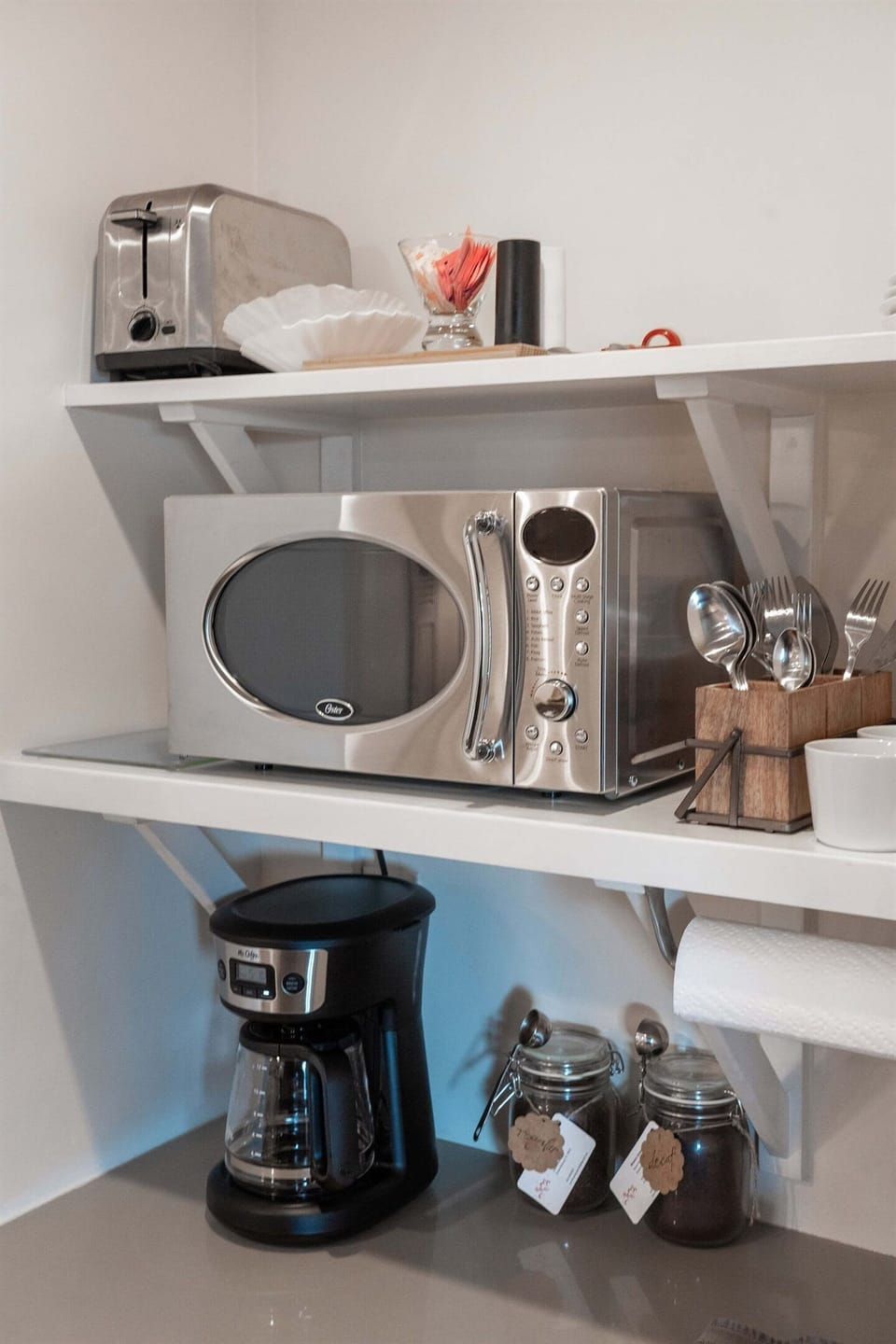 The kitchenette includes everything you need for light bites, quick meals, and the all-important morning brew.