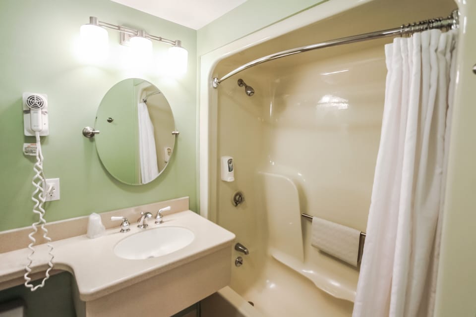 The well-appointed bathroom features modern fixtures and ample space, ensuring comfort after a day of adventure.