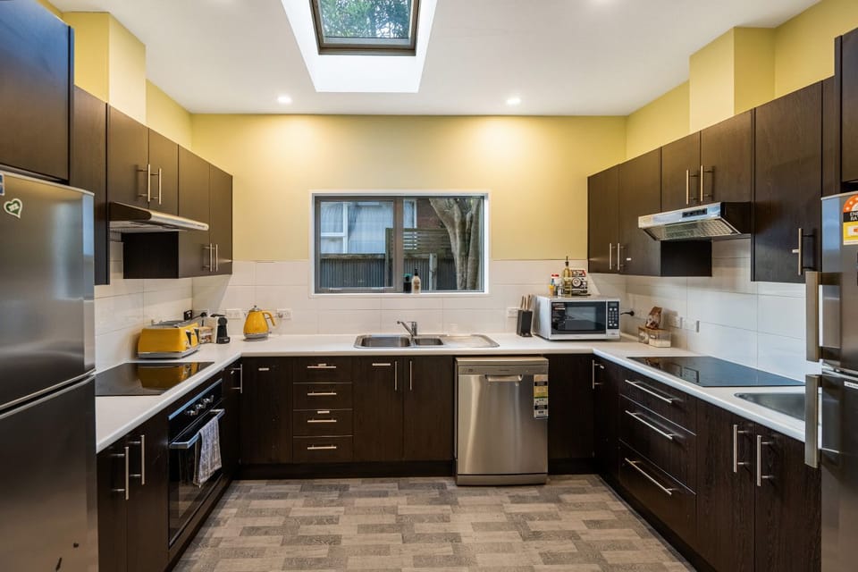 Large kitchen with two sinks, two cooktops, two fridges, coffee machine and fully equipped with your needs!