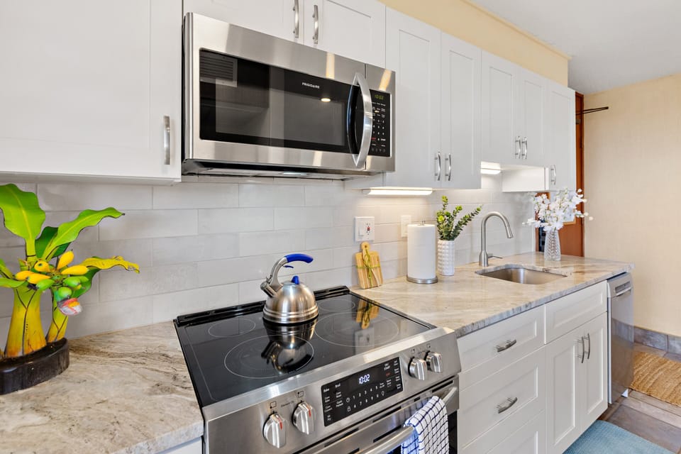 Fully equipped kitchen with stainless steel appliances and plenty of prep space