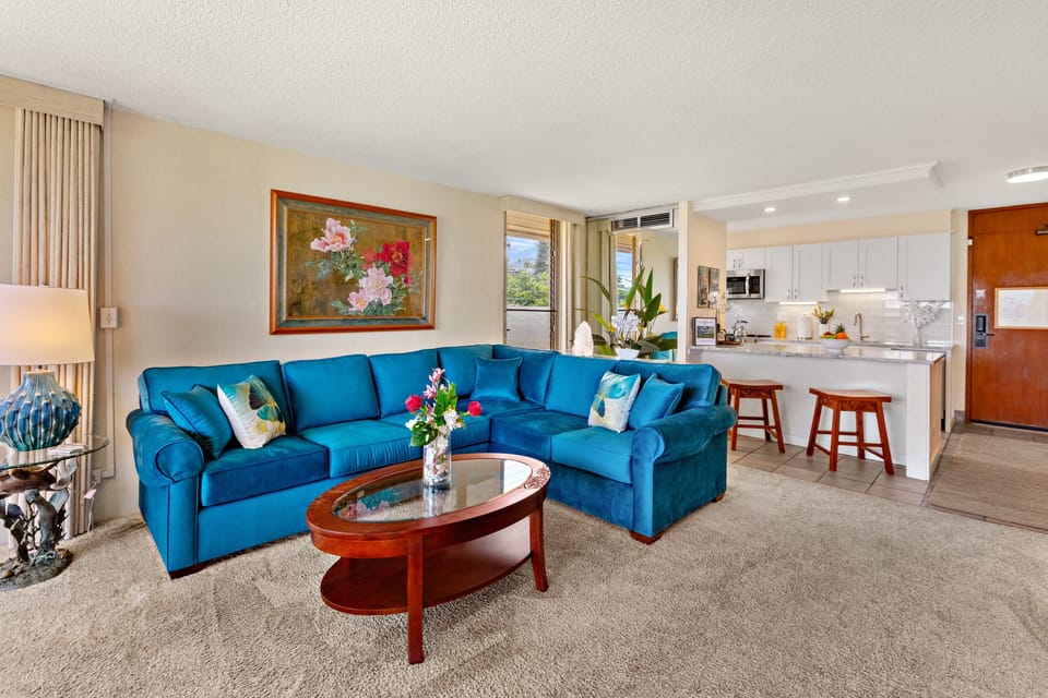 Open-concept living with cozy seating and a queen sleeper sofa