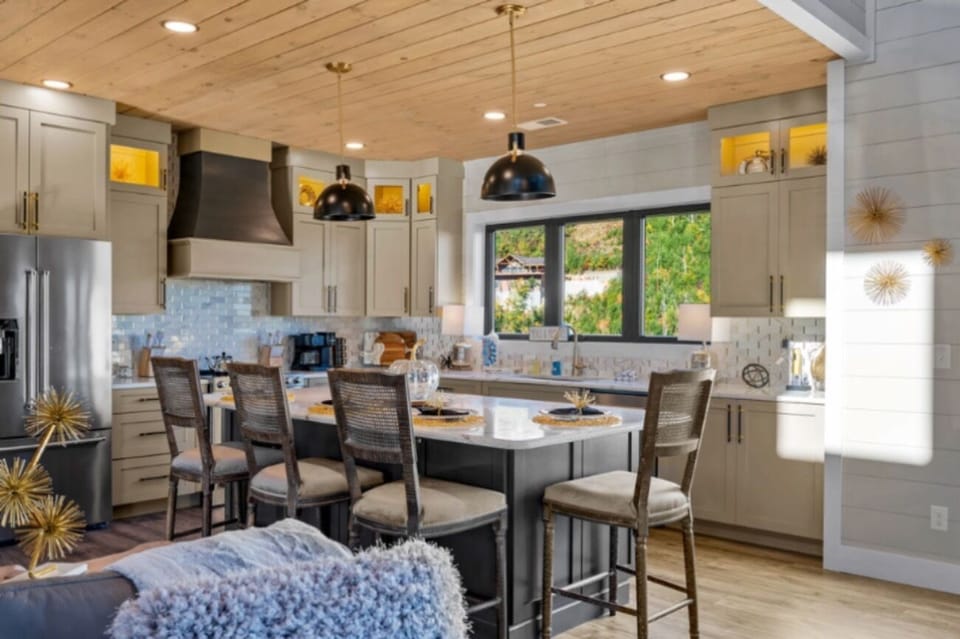 Beautiful custom kitchen with granite countertops, bar area with seating for 5. 