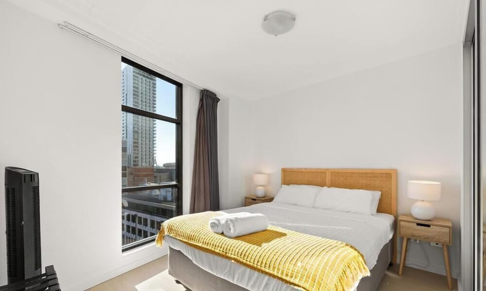 A  bed adorned with  pillows