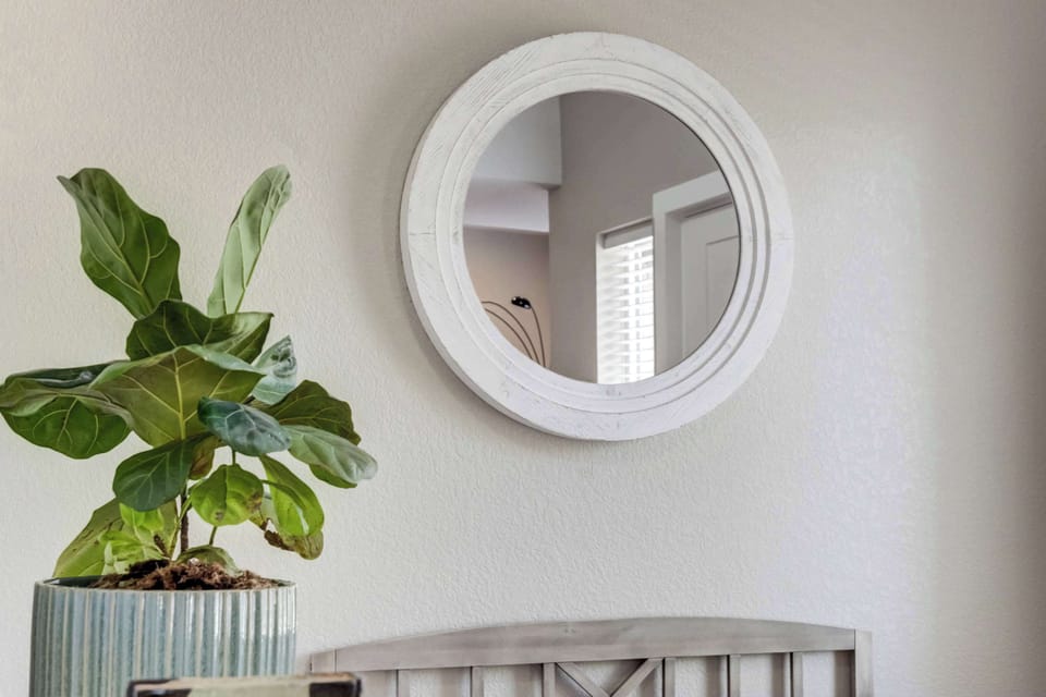 Thoughtful details like greenery, soft textures, and curated decor bring warmth and personality to every corner of the home.








