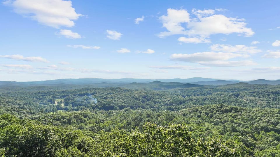 Wake up to breathtaking views that surround the cabin, where every window frames a perfect picture of tranquility.