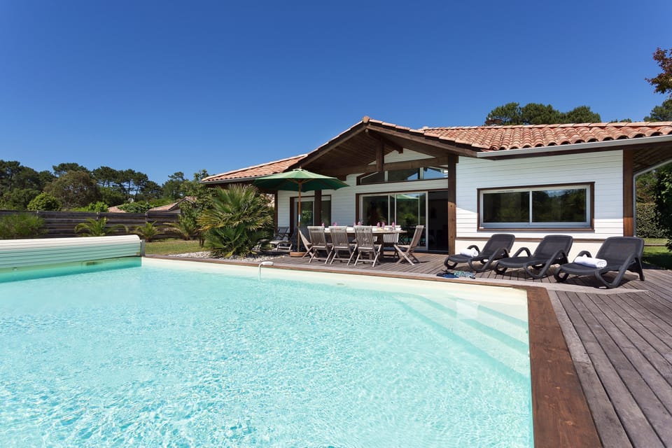 Have fun splashing around in the outdoor pool by your villa!