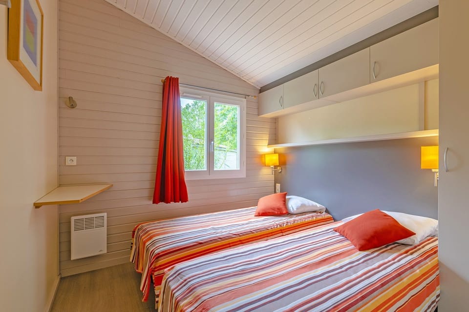 The second bedroom contains 2 Single beds.