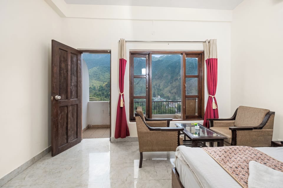 Deluxe Room With Garden View | Premium bedding, desk, laptop workspace, free WiFi
