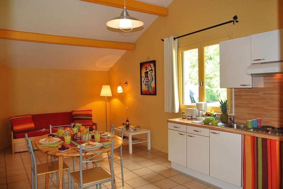 Prepare meals in the kitchenette and enjoy them at the dining table.