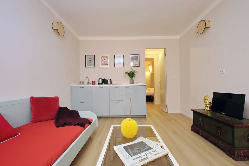 Apartment (1 Bedroom) | Living area | 32-inch flat-screen TV with cable channels