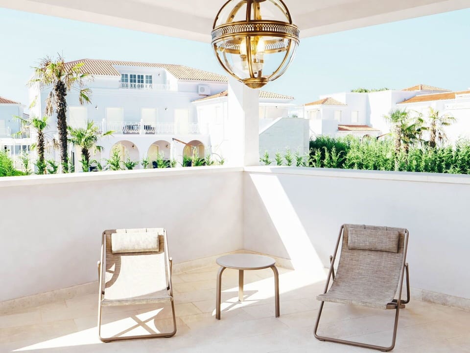 Furniture, Chair, Outdoor Furniture, Interior Design, Floor, Wicker, Shade, Design, Balcony, Houseplant